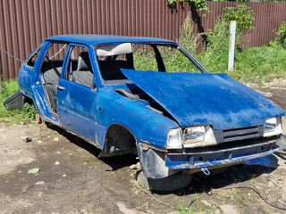Old broken rusty passenger car