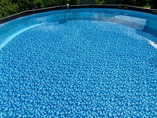 Clear blue water in a circular frame pool. High quality 4k footage