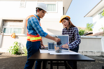 Renewable energy technician, yellow hard hat, safety vest, solar panels, clean energy wind...