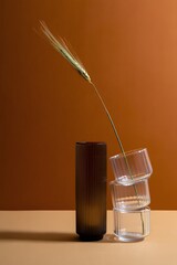 Still life photography of vases and wheat stalk against a brown background for home decor