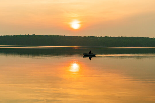 Sun setting on a river - Powered by Adobe