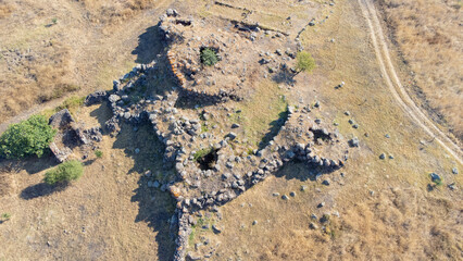 Drone view of Cobulas Nuraghe, prehistoric pentalobate stone structure in Sardinia