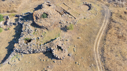 Drone view of Cobulas Nuraghe, prehistoric pentalobate stone structure in Sardinia