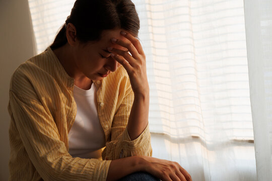 Depressed young asian woman with mental health problem in mind need crucial treatment from overthinking fatigue girl, disruptive thought, dissocial, anxiety and mental health disorders.
