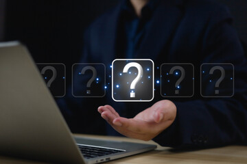 Question mark shows on a palm, Businessman show question mark icon, Technology question concept, FAQ, Wondering questioning and problem-solving, Q and A, ask