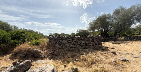 Remains of prehistoric stone huts in the Nuragic village of Serra Orrios, Sardinia