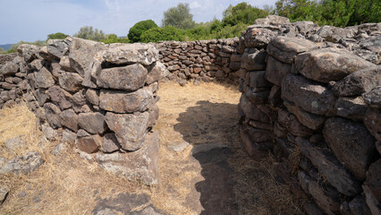 Remains of prehistoric stone huts in the Nuragic village of Serra Orrios, Sardinia