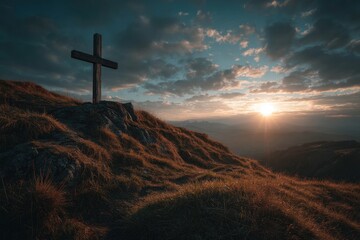 A serene landscape shows a wooden cross on a rocky hill as the sun rises, casting warm light over the grassy terrain and dramatic clouds