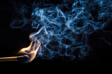 Burning match, swirling blue smoke