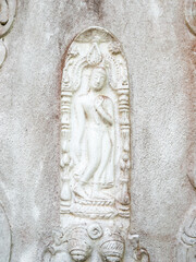 Serene Buddha Relief on Temple Wall.