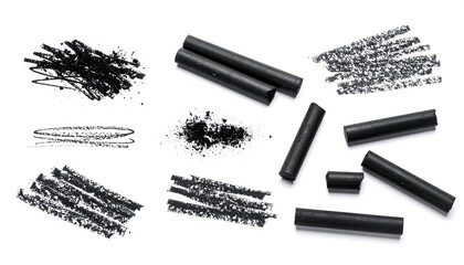 Black colored pencils and charcoal marks on white background