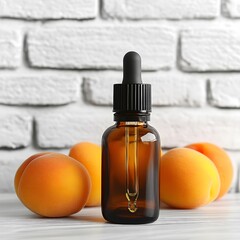 Apricot Essential Oil in Amber Bottle with Fresh Apricots