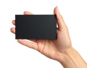 A hand holding a blank black rectangular card against a black background.