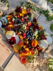 Sun-Drenched Summer Grazing Board with Cheese, Fruit, and Edible Flowers