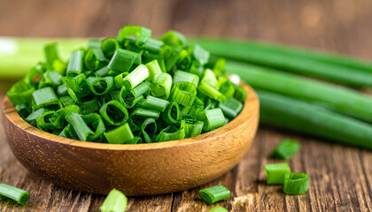 Green onion cut into small pieces in wooden bowl. Fresh spring green scallion. Natural product.