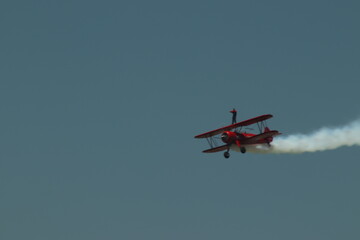 Plane flying in the sky with man on top