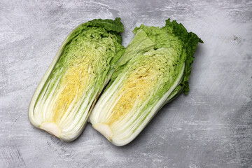 Fresh Chinese cabbage on grey background, top view. Healthy food
