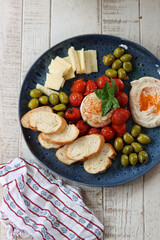 Italian antipasti with tomatoes, olives and cheese
