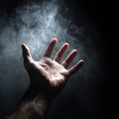 A hand reaching out, surrounded by mist