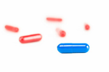 Red and blue pills representing a difficult choice or decision. A metaphor for reality vs. illusion, this concept from the Matrix is about strategy, technology, and future paths.