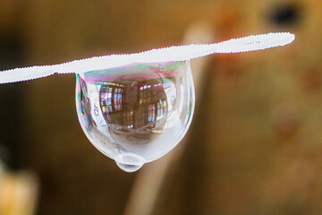 Soap bubbles on a straw