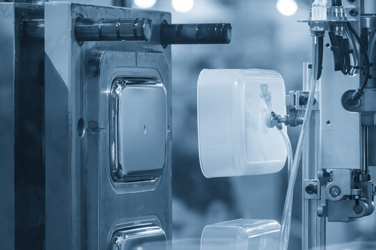 The food container production process by automatic system from plastic injection mold machine.