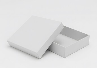 A slightly open white box with a lid resting beside it on a white surface in a studio setting view
