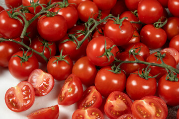 Lots of ripe fresh cocktail tomatoes close-up.