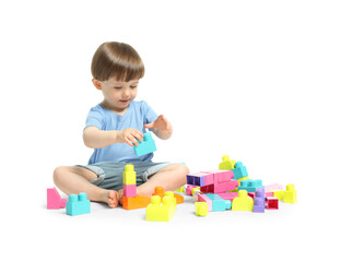 Obraz premium Cute little boy playing with building bricks on white background