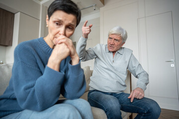 Hysterical elderly man yelling and scolding depressed wife, disturbance. Mental disorder, verbal...