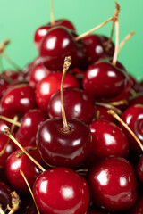 Fresh Sweet Cherries with Vibrant Green Backdrop.