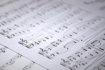Sheet with musical notes as background, closeup