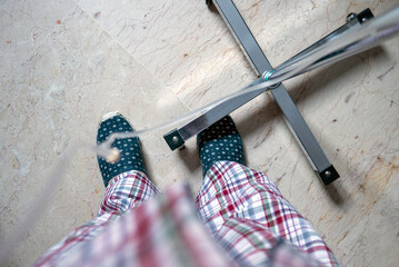 Patient in Comfortable Slippers Standing by IV Pole in a Hospital Room