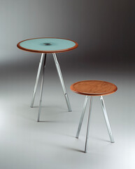 Still life of two round tables, on a neutral background