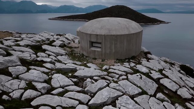 aerial reveal of abandoned cold war bunkers on the albanian coast near cape of rodon highlighting remnants of enver hoxha&rsquo;s military defenses and the hidden legacy of european communist history