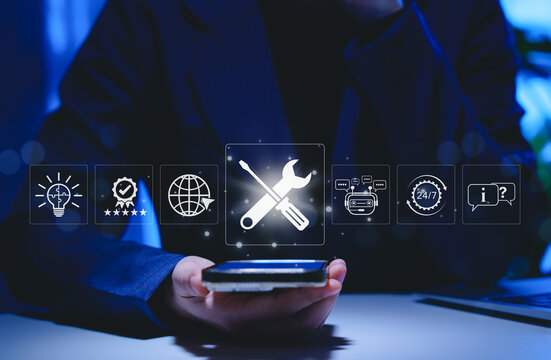 Technical support and customer service concept. Person using smartphone with icons representing technical support, AI chatbot, 24/7 service, solutions for global support, and customer assistance tools