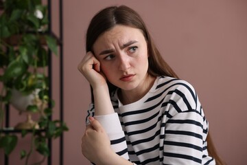 Worried woman suffering from paranoia at home