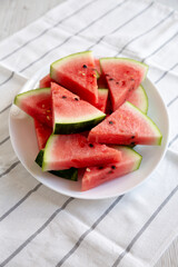 Raw Organic Watermelon Slices on a Plate, side view.