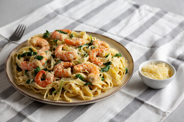 Homemade Creamy One-Pot Spinach Shrimp Pasta on a Plate, side view.