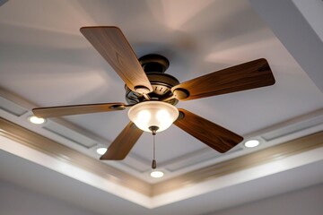 Residential ceiling fan with light turned on, providing illumination and air circulation