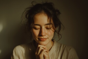 Woman Expresses Humble Gratitude in Serene Ivory Minimalist Interior