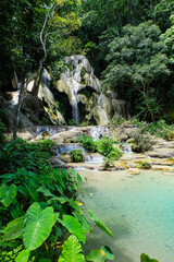 Most magnificent and breathtaking nature of Kuang Si waterfall and cascade and its green, emerald...