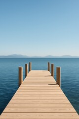 Fototapeta premium Symmetrical wooden pier stretching into a calm lake under a clear blue sky, with mountains in the distance.