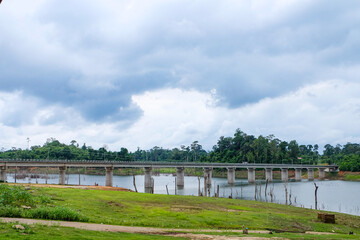 Fresh green nature, local boats, fisherman at Nakai Plateau Reservoir of Namthuen 2 dam and hydropower, Laos  