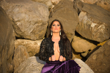 Woman, young, beautiful, brunette, flamenco dancer, with a flamenco velvet jacket and skirt,...