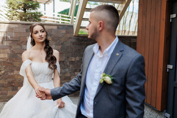Couple sharing an emotional moment during their wedding ceremony in an outdoor setting