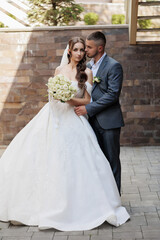 Elegant couple celebrates love during outdoor wedding ceremony in quaint setting