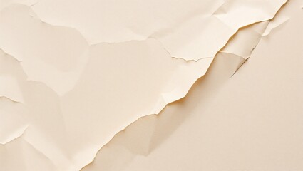 Macro shot of a crumpled sheet of beige paper. Prominent folds and shadows create an abstract pattern.