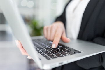 Close up of a business woman with a laptop