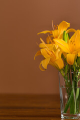 Minimalistic floral card with lilies on a brown background